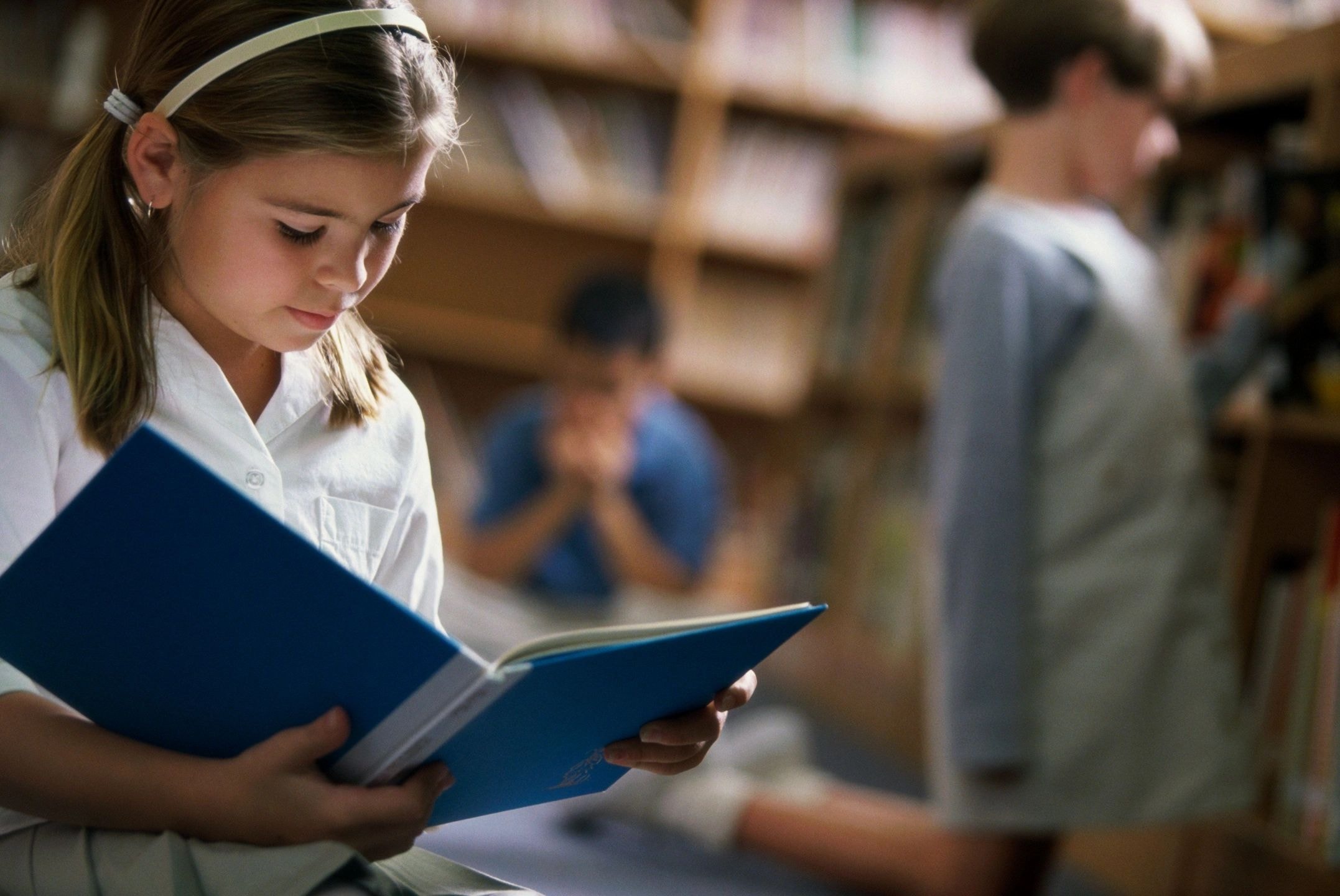 Girl reading in library